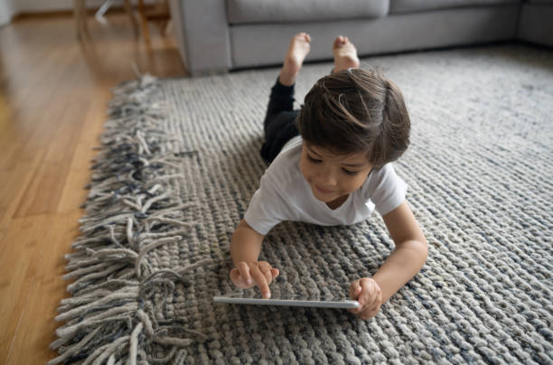 Girl laying on carpet floor | Chillicothe Carpet